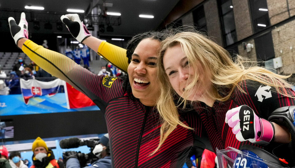 Laura Nolte and Deborah Levi, of Germany, celebrate winning the gold medal in the women's bobsleigh at the 2022 Winter Olympics, Saturday, Feb. 19, 2022, in the Yanqing district of Beijing.(AP Photo/Dmitri Lovetsky)