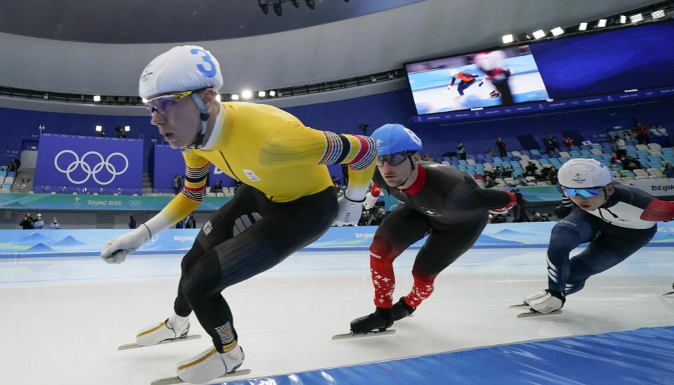 Bart Swings of Belgium, center, leads athletes as they compete during the men's speedskating mass start finals at the 2022 Winter Olympics, Saturday, Feb. 19, 2022, in Beijing. (AP Photo/Ashley Landis)