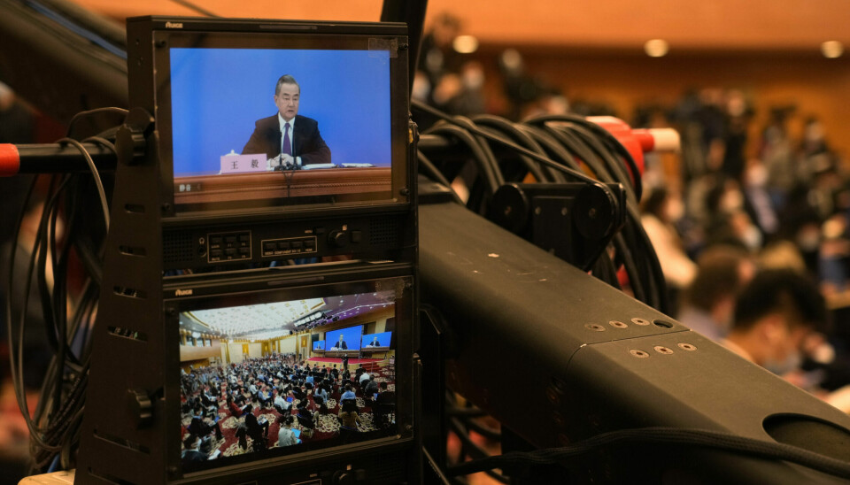 Chinese Foreign Minister Wang Yi speaks during a remote video press conference held on the sidelines of the annual meeting of China's National People's Congress (NPC) in Beijing, Monday, March 7, 2022. (AP Photo/Sam McNeil)
