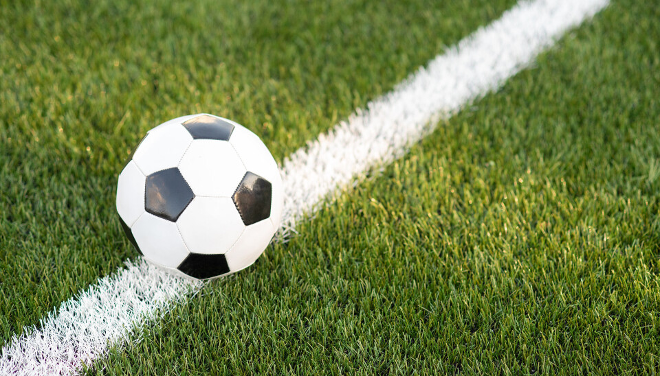 Traditional soccer ball on the grass. Ball on gras in soccer stadium